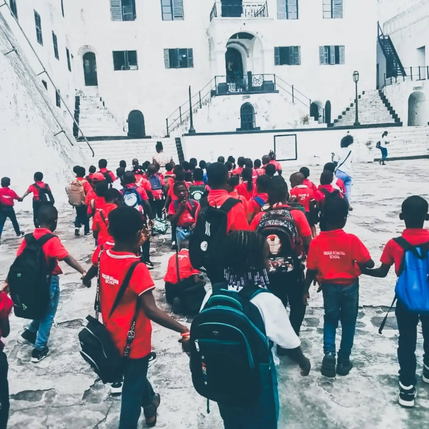 A class walking through the castle courtyard